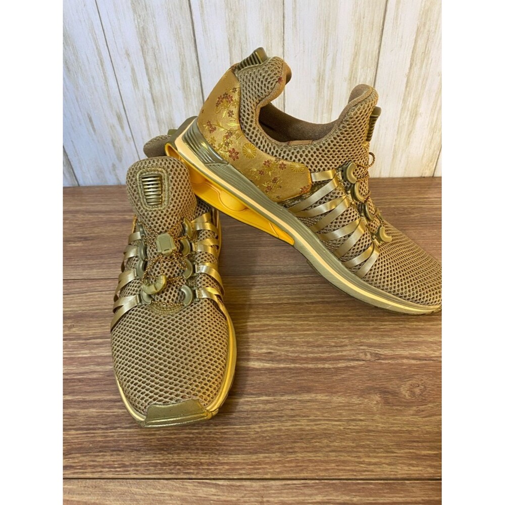 Nike Women's Metallic Gold Athletic Sneakers with Floral Accents